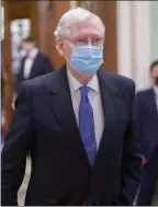  ?? The Associated Press ?? Sen. Mitch McConnell, R-Ky., the top Republican in Senate, leaves the chamber after Vice President Kamala Harris swore in three new Democratic senators, at the Capitol in Washington.