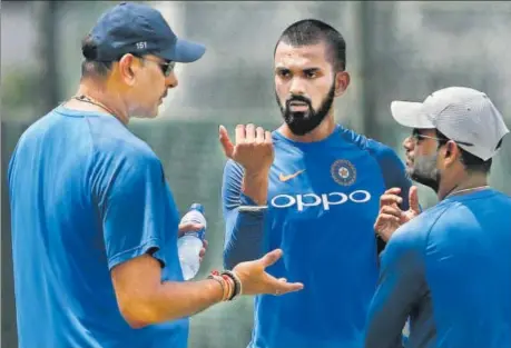  ?? REUTERS ?? KL Rahul (centre) looks on as India coach Ravi Shastri talks during their training session ahead of the second Test against Sri Lanka at the SSC, Colombo.