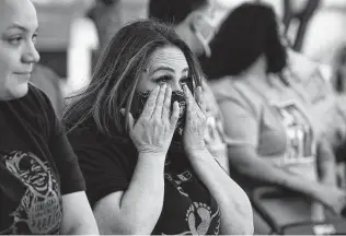  ?? Jessica Phelps / Staff photograph­er ?? Friends and family of James Chairez, who turns 2 in July, attend a vigil held in his honor at Westwood Village Park. James was last seen in security camera footage on the Southwest Side.