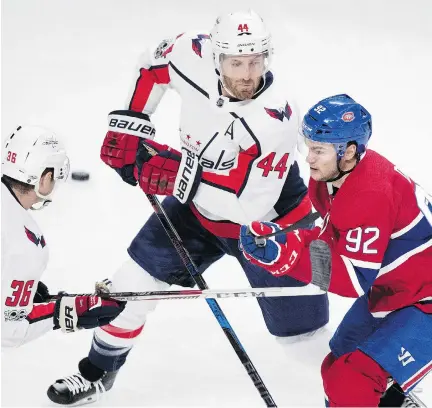  ?? ALLEN MCINNIS ?? Habs left-winger Jonathan Drouin is held up by Capitals defenders Connor Hobbs, left, and Brooks Orpik Wednesday at the Bell Centre.