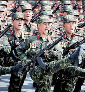  ?? AP/WONG MAYE-E ?? North Korean soldiers high-step across Pyongyang’s Kim Il Sung Square on Saturday in a parade celebratin­g the country’s founder and displaying an array of modern weaponry.