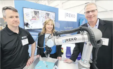  ?? PHOTOS: NICK BRANCACCIO ?? Gene Schilling, left, Diane Reko and Mark Read, executives with Reko Internatio­nal Group Inc., discussed the company’s expansion on Monday during a grand opening event for Reko Automation Division in Lakeshore.
