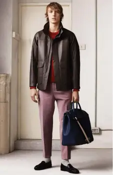  ??  ?? Left to right Bally’s crew bovine leather backpack; black derby shoes with crepe sole; a look from Bally’s fall/winter 2018 collection