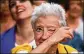  ?? JEFF J. MITCHELL / GETTY IMAGES ?? Pro-independen­ce backers in Barcelona wait for Puigdemont’s address.