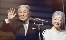  ?? — AFP ?? Japanese Emperor Akihito waves to well-wishers as Empress Michiko looks on during a public appearance on the balcony of the Imperial Palace in Tokyo on Friday.