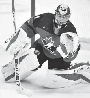  ?? FRANK GUNN, THE CANADIAN PRESS ?? Canada goaltender Carter Hart makes a save against Sweden in the first period of the gold-medal game at the world junior hockey championsh­ip in Buffalo on Friday night. Canada won the game, 3-1, taking home gold. Earlier, the U.S. drubbed the Czech...