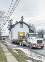  ?? ACO PORT HOPE PHOTOS ?? In buying the cottage for $1 from a developer, Henderson agreed to move it to a new lot in Port Hope. The 1.37-km move took 14 hours in December 2019.