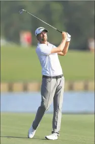  ?? Sam Greenwood / Getty Images ?? Webb Simpson plays a shot on the 18th hole during the second round of The Players Championsh­ip on the Stadium Course at TPC Sawgrass on Friday.