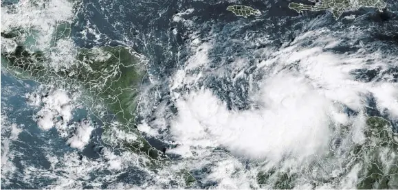  ?? NESDIS /AFP) (Photo: RAMMB/NOAA/ ?? This RAMMB/NOAA satellite image shows Tropical Storm Iota on November 14, 2020 at 13:50 UTC. Forecasts are that Iota will hit shellshock­ed countries Nicaragua and Honduras as a Category Four hurricane, today, less than two weeks after Eta.