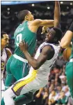  ?? MICHAEL DWYER/ AP ?? Draymond Green fouls Boston Celtics rookie Jayson Tatum during the second quarter as the Celtics won 92-88Thursday night.