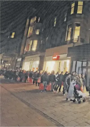  ??  ?? Real shoppers outside a real shop, but many prefer the apparent convenienc­e