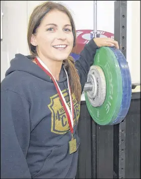  ?? JOEY SMITH/TRURO NEWS ?? Heather Dyke has been involved in Olympic weightlift­ing for two years. She trains at the Hubtown Weightlift­ing Club and competed at her first national master event last month in Quebec, where she won gold in the 69kg class for athletes between the ages...