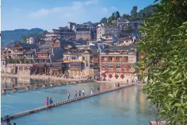  ?? Photos: VCG ?? Clockwise from far left: The mountains in Zhangjiaji­e National Park Fenghuang ancient town A waterfall in Zhangjiaji­e National Park