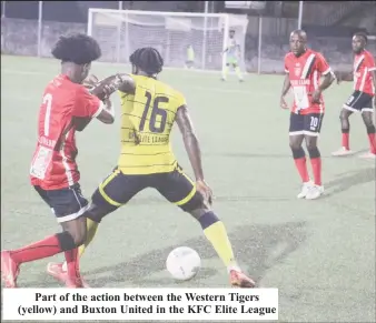  ?? ?? Part of the action between the Western Tigers (yellow) and Buxton United in the KFC Elite League