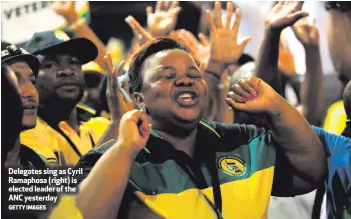  ?? GETTY IMAGES ?? Delegates sing as Cyril Ramaphosa (right) is elected leader of the ANC yesterday