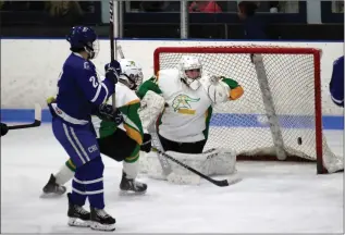  ?? Photo by Louriann Mardo-Zayat / lmzartwork­s.com ?? Cumberland defenseman Ryan Taylor (2) watches a puck go past North Smithfield goalie Forrest Zuba in the No. 1 Clippers’ 2-1 victory over the Northmen to advance to the Division II semifinals.