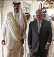  ?? CONTRIBUTE­D BY ALEXANDER W. RIEDEL / U.S. STATE DEPARTMENT ?? Emir Tamim bin Hamad Al Thani (left) walks with Secretary of State Rex Tillerson on Tuesday in Doha, Qatar. Qatar agreed to bolster its fight against terrorism.