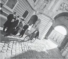  ??  ?? Actors taking their places in a scene for Spanish movie ‘Picasso’s Gang’, at the Lions’ square of the Buda Palace in Budapest, in 2011. (Left) Australian actor Jackman chats with crew members on the Szabadsag bridge in Budapest during a film shoot, in...