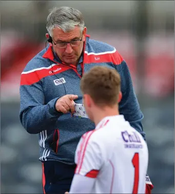  ??  ?? Cork manager Seán Hayes speaking with Ian Giltinan of Cork following the EirGrid Munster GAA Football U-20 Championsh­ip quarter-final match between Cork and Tipperary at Páirc UÍ Rinn