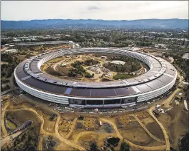  ?? LIPO CHING — STAFF PHOTOGRAPH­ER ?? An aerial view of the Apple Campus 2 in Cupertino. The tech giant defended net neutrality in a letter to the Federal Communicat­ions Commission on Thursday. The company also announced a 'special event' Sept. 12, where the latest iPhone will most likely...