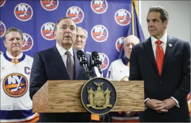  ?? JOHN MINCHILLO ?? NHL commission­er Gary Bettman, left, speaks alongside New York Governor Andrew Cuomo, right, during a news conference before an NHL hockey game between the Boston Bruins and New York Islanders, Saturday, Feb. 29, 2020, in Uniondale, NY.