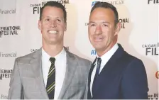  ?? CRYSTAL SCHICK FILES ?? Mark Tewksbury, with partner Rob Mabee, has been out for more than 20 years. He endured bullying and loneliness.