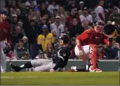  ?? MARY SCHWALM — THE ASSOCIATED PRESS ?? The Chicago White Sox’s Adam Engel, center, scores ahead of a throw to Boston Red Sox catcher Kevin Plawecki, right, on a sacrifice fly by Reese McGuire during the eighth inning Friday at Fenway Park in Boston.