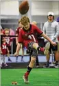  ?? HYOSUB SHIN / HYOSUB. SHIN@AJC.COM ?? Ellis Couch, 10, kicks a football Friday at the Dr Pepper SEC FanFare at the Georgia World Congress Center ahead of today’s game.