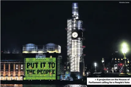  ?? Victoria Jones ?? &gt; A projection on the Houses of Parliament calling for a People’s Vote