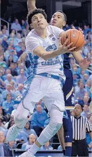  ?? Grant Halverson Getty Images ?? JUSTIN JACKSON, North Carolina’s leading scorer, goes to the basket against Notre Dame in February. The Tar Heels are the South Regional’s No. 1-seeded team.