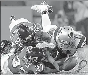  ?? AP FILE PHOTO ?? The Patriots’ Julian Edelman (right) makes a catch as the Falcons’ Ricardo Allen and Keanu Neal defend Feb. 5 during Super Bowl 51 in Houston. The play helped rally the Patriots from a 28-3 deficit to a 34-28 victory.