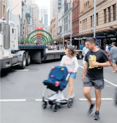  ?? Picture / AAP ?? While some Sydney shoppers said the presence of the trucks and barriers made them feel safer, others said they were still nervous about the possibilit­y of a terror attack.