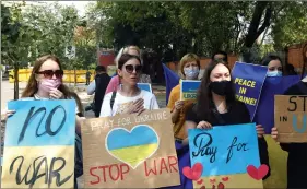  ?? ?? Ukrainian citizens hold placards as they gather in solidarity with the people of Ukraine, at Jantar Mantar, in New Delhi on 6 March. ANI