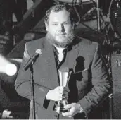  ?? AMY HARRIS/INVISION ?? Luke Combs accepts the Gene Weed Milestone Award at the annual ACM Honors on Wednesday.