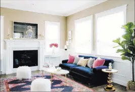  ?? Mary Costa ?? Jessica Mcclendon In this living room, designed by interior designer Jessica Mcclendon, the richness of a royal blue sofa and gold-toned accessorie­s is balanced by the softness of neutral walls.