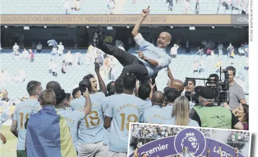  ??  ?? 0 Manchester City players hoist manager Pep Guardiola as they celebrate their title triumph. Inset, the players with their trophy.