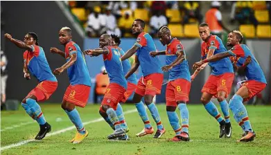  ??  ?? Entertaini­ng moves: DR Congo players celebrate by dancing the ‘Fimbu’ following their third goal against Togo in the African Nations Cup on Jan 24. — AFP