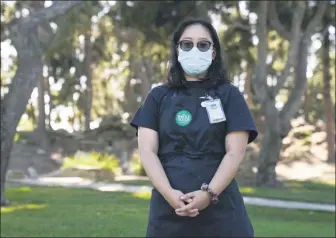  ?? ASHLEY LANDIS — THE ASSOCIATED PRESS ?? Katie Doan, a former Whole Foods employee, poses for a photo July 16, in Costa Mesa, Calif. Doan started tracking COVID-19 cases at Amazonowne­d Whole Foods in April.