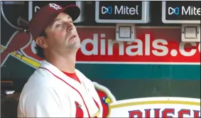  ?? AP/JEFF ROBERSON ?? St. Louis Cardinals manager Mike Matheny watches from the dugout June 30 during the sixth inning against the Atlanta Braves in St. Louis.