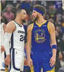  ?? AP PHOTO/TONY AVELAR ?? Golden State Warriors guard Klay Thompson, right, and Memphis Grizzlies forward Dillon Brooks argue during Game 6 of their Western Conference semifinal series in the NBA playoffs Friday night in San Francisco. The Warriors won 110-96 to wrap up the best-of-seven series.