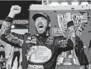  ?? [TERRY RENNA/THE ASSOCIATED PRESS] ?? Martin Truex Jr. celebrates in Victory Lane after winning the NASCAR Cup Series race and season championsh­ip Sunday at Homestead-Miami Speedway in Homestead, Fla.