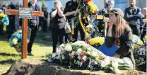  ?? PHOTO: GETTY IMAGES ?? Fallen soldier . . . Vira Moisenko mourns her husband, Olexandr Moisenko, early yesterday in Lviv, Ukraine. He served as a combat medic and died in the Luhansk region of Ukraine.