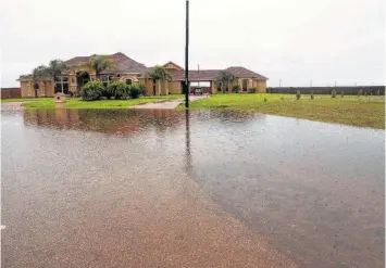  ?? Rachel Denny Clow / Associated Press ?? A report by the Texas Water Developmen­t Board says coastal and river flooding will cause more than $6.8 billion in property losses over the next five years.