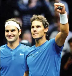  ??  ?? Switzerlan­d’s Roger Federer of Team Europe and his teammate Spain’s Rafael Nadal celebrate their victory over team World’s Sam Querrey and Jack Sock during the second day of Laver Cup on September 23, 2017 in O2 Arena, in Prague. - AFP photo