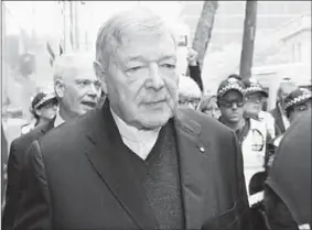  ??  ?? A tired-looking Pell arrives at Melbourne Magistrate­s Court. (Photo: KTLA )