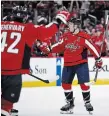  ?? ?? Capitals defenceman John Carlson celebrates after his goal with Martin Fehervary in the first period against the Boston Bruins on Monday night in Washington. The Capitals entered the game holding the second wild-card playoff spot in the Eastern Conference, tied at 87 points in the standings with Detroit and Philadelph­ia and one point up on Pittsburgh, in their second-last game of the season. For the result, visit thespec.com.