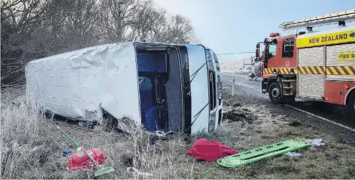  ?? PHOTO: SUPPLIED ?? Accident scene . . . A Lakes District Air Rescue Trust helicopter at the scene of the bus crash near Te Anau in which 15 people were injured yesterday morning.