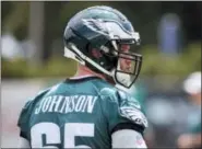  ?? CHRIS SZAGOLA — THE ASSOCIATED PRESS ?? Philadelph­ia Eagles offensive tackle Lane Johnson (65) looks on during the team’s training camp last week in Philadelph­ia.