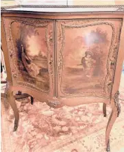  ?? READER SUBMITTED/TNS ?? This cabinet is supposed to resemble a piece made in France in the 18th century.