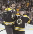  ?? AP PHOTO ?? TWO GOOD: Zdeno Chara and Brad Marchand celebrate during the Bruins’ on Saturday.